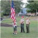 Boy Scouts Holding American Flag During Ceremony