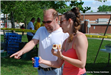 Man and Woman Looking at Something at the Bike Rodeo