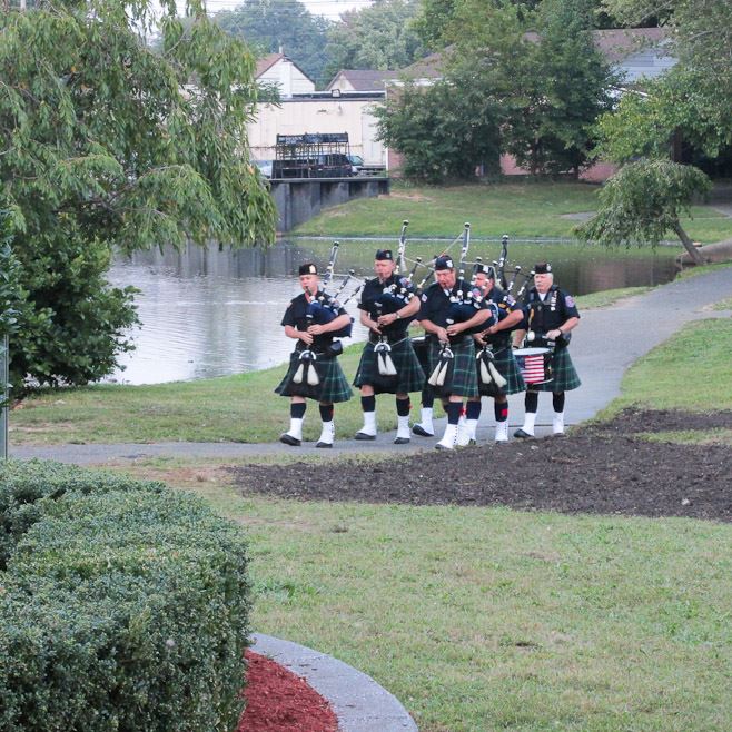 Bagpipe Players Walking Toward Ceremony