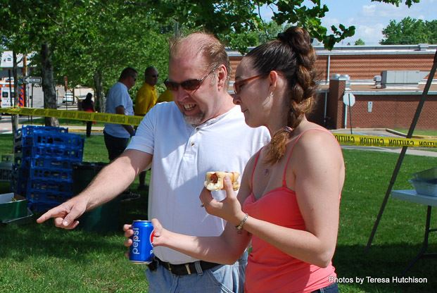 Man and Woman Looking at Something at the Bike Rodeo