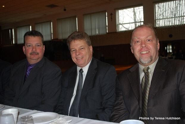Three Men Smiling for Camera