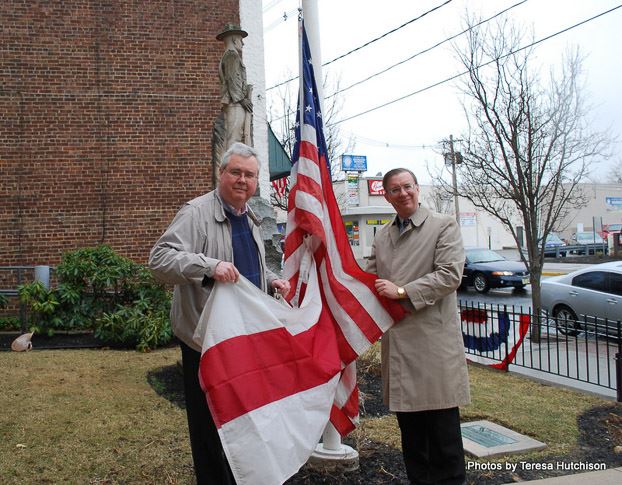 Men Posing with Flag for Picture