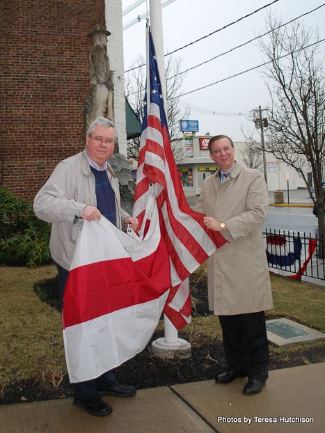 Men Posing with Flag for Picture (2)